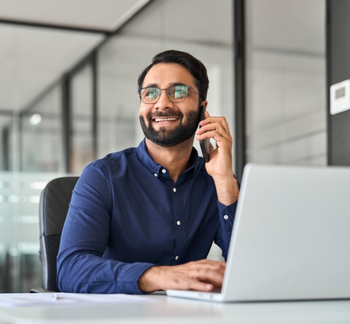 Dark blue sjhirt male at desk_2395784513_edited