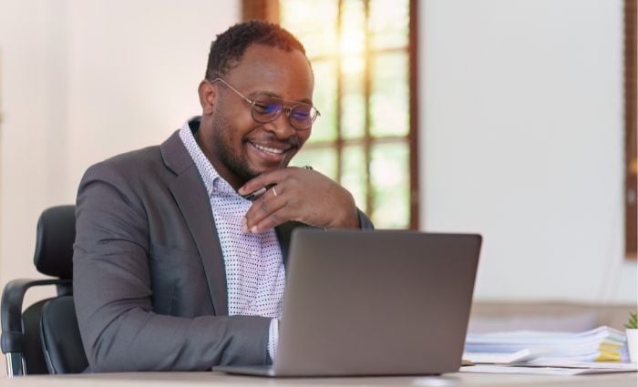 Happy Banker At Computer Male AfricanAmerican