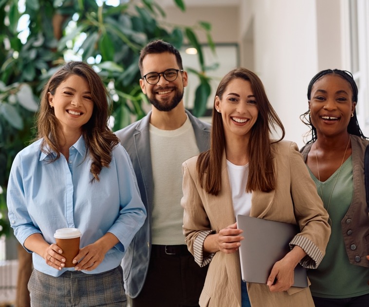 four young professionals standing_2464458483_edited