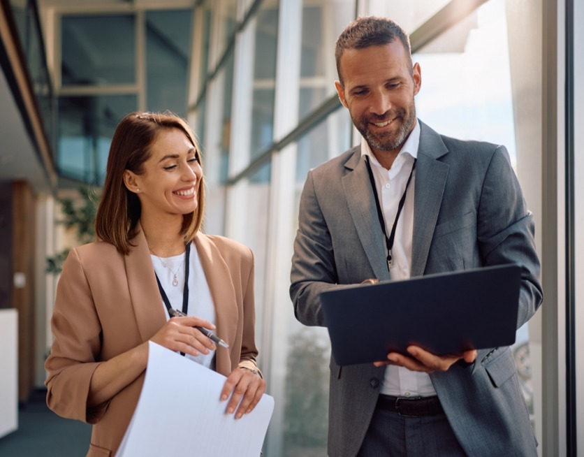 man woman standing with computer_2599803595_edited